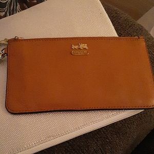 Dark Tan Coach Wristlet